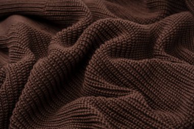 Arka plan olarak kahverengi süveter dokusu. Üst görünüm. 