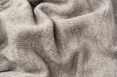 Arka plan olarak gri yün süveter dokusu. Üst görünüm.