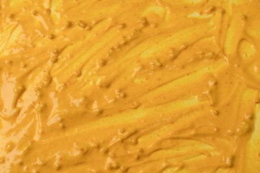 Sarı sos arka plan olarak sıçrıyor. Üst görünüm. 