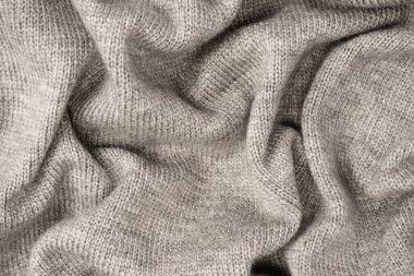 Arka plan olarak gri yün süveter dokusu. Üst görünüm.