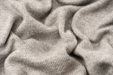 Arka plan olarak gri yün süveter dokusu. Üst görünüm.
