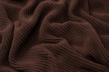 Arka plan olarak kahverengi süveter dokusu. Üst görünüm. 