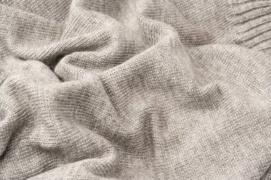 Arka plan olarak gri yün süveter dokusu. Üst görünüm.