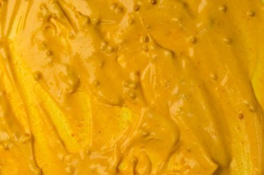 Sarı sos arka plan olarak sıçrıyor. Üst görünüm. 