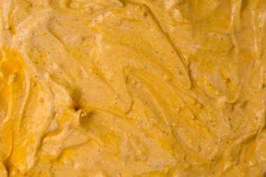 Sarı sos arka plan olarak sıçrıyor. Üst görünüm. 