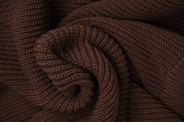 Arka plan olarak kahverengi süveter dokusu. Üst görünüm. 