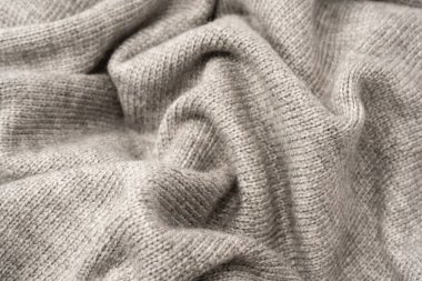 Arka plan olarak gri yün süveter dokusu. Üst görünüm.
