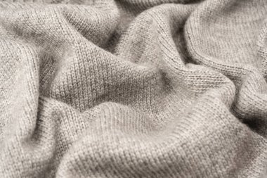 Arka plan olarak gri yün süveter dokusu. Üst görünüm.