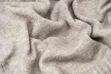 Arka plan olarak gri yün süveter dokusu. Üst görünüm.