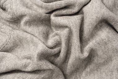 Arka plan olarak gri yün süveter dokusu. Üst görünüm.