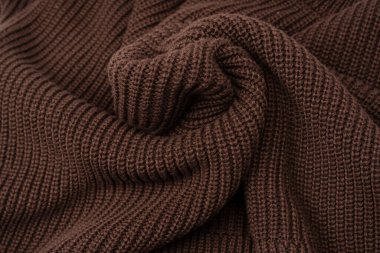 Arka plan olarak kahverengi süveter dokusu. Üst görünüm. 