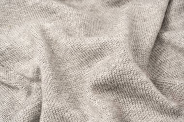 Arka plan olarak gri yün süveter dokusu. Üst görünüm.