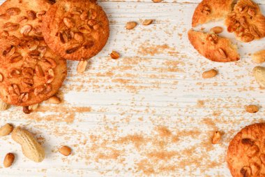 Peanut cookies on wooden table with sugar.  