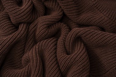 Arka plan olarak kahverengi süveter dokusu. Üst görünüm. 