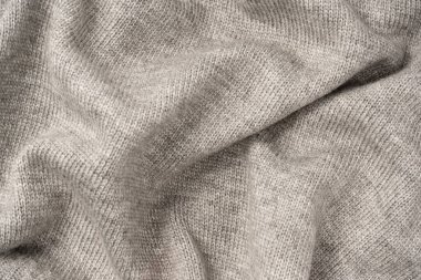 Arka plan olarak gri yün süveter dokusu. Üst görünüm.