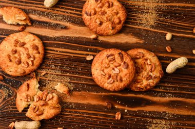 Peanut cookies on wooden table with sugar.  