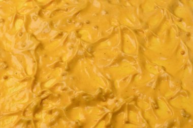 Sarı sos arka plan olarak sıçrıyor. Üst görünüm. 