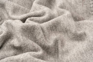 Arka plan olarak gri yün süveter dokusu. Üst görünüm.