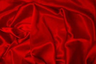 Zengin ve lüks kırmızı ipek kumaş dokusu. Üst görünüm.