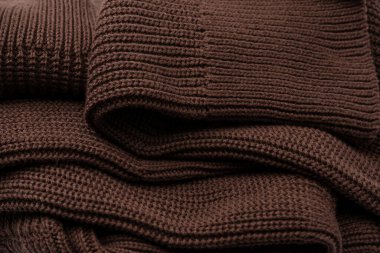 Arka plan olarak kahverengi süveter dokusu. Üst görünüm. 