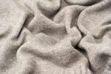 Arka plan olarak gri yün süveter dokusu. Üst görünüm.