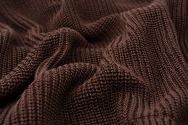 Arka plan olarak kahverengi süveter dokusu. Üst görünüm. 