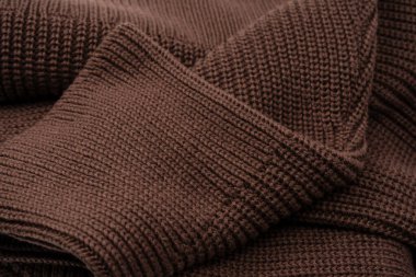 Arka plan olarak kahverengi süveter dokusu. Üst görünüm. 
