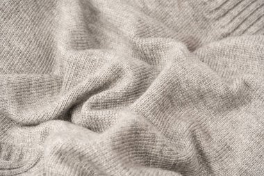 Arka plan olarak gri yün süveter dokusu. Üst görünüm.