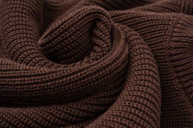 Arka plan olarak kahverengi süveter dokusu. Üst görünüm. 
