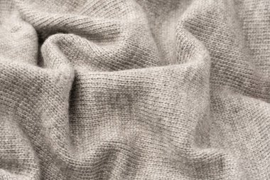 Arka plan olarak gri yün süveter dokusu. Üst görünüm.