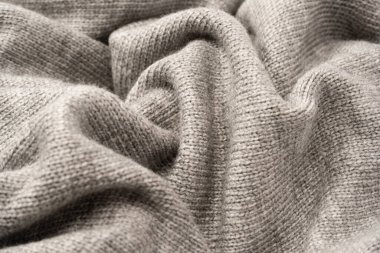 Arka plan olarak gri yün süveter dokusu. Üst görünüm.