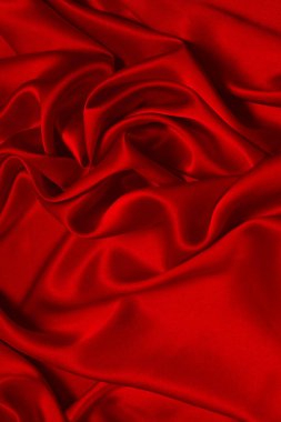 Zengin ve lüks kırmızı ipek kumaş dokusu. Üst görünüm.