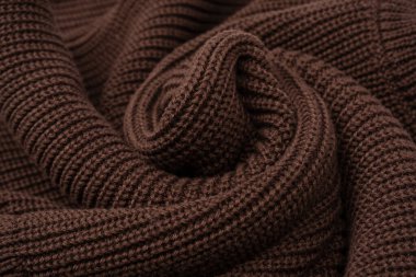 Arka plan olarak kahverengi süveter dokusu. Üst görünüm. 