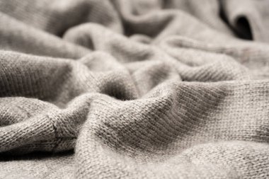 Arka plan olarak gri yün süveter dokusu. Üst görünüm.
