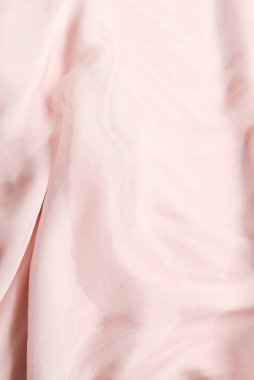 Yumuşak, pembe ipek kumaş arka plan. Kumaş dokusu. 