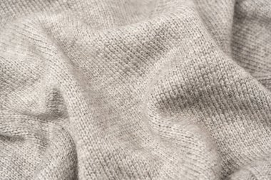 Arka plan olarak gri yün süveter dokusu. Üst görünüm.