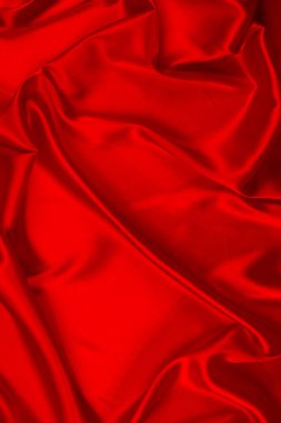 Kırmızı ipek ya da saten lüks kumaş dokusu soyut bir arka plan olarak kullanılabilir. Üst görünüm.