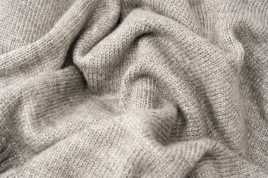 Arka plan olarak gri yün süveter dokusu. Üst görünüm.