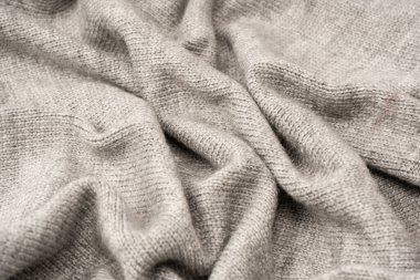 Arka plan olarak gri yün süveter dokusu. Üst görünüm.