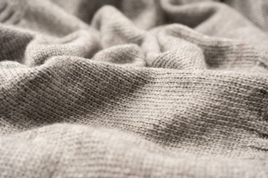 Arka plan olarak gri yün süveter dokusu. Üst görünüm.