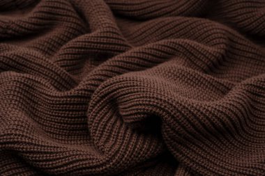 Arka plan olarak kahverengi süveter dokusu. Üst görünüm. 