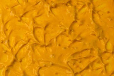 Sarı sos arka plan olarak sıçrıyor. Üst görünüm. 