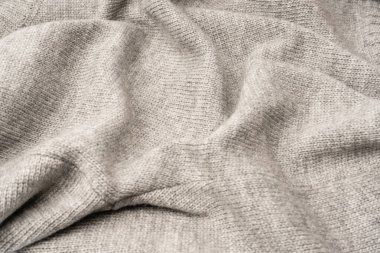 Arka plan olarak gri yün süveter dokusu. Üst görünüm.