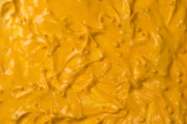 Sarı sos arka plan olarak sıçrıyor. Üst görünüm. 