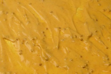 Sarı sos arka plan olarak sıçrıyor. Üst görünüm. 