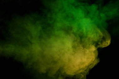 Siyah arka planda mavi ve sarı buhar. Boşluğu kopyala.