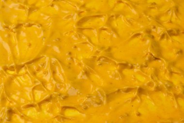 Sarı sos arka plan olarak sıçrıyor. Üst görünüm. 