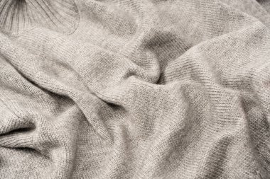 Arka plan olarak gri yün süveter dokusu. Üst görünüm.