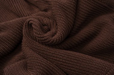 Arka plan olarak kahverengi süveter dokusu. Üst görünüm. 