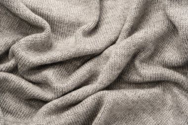 Arka plan olarak gri yün süveter dokusu. Üst görünüm.